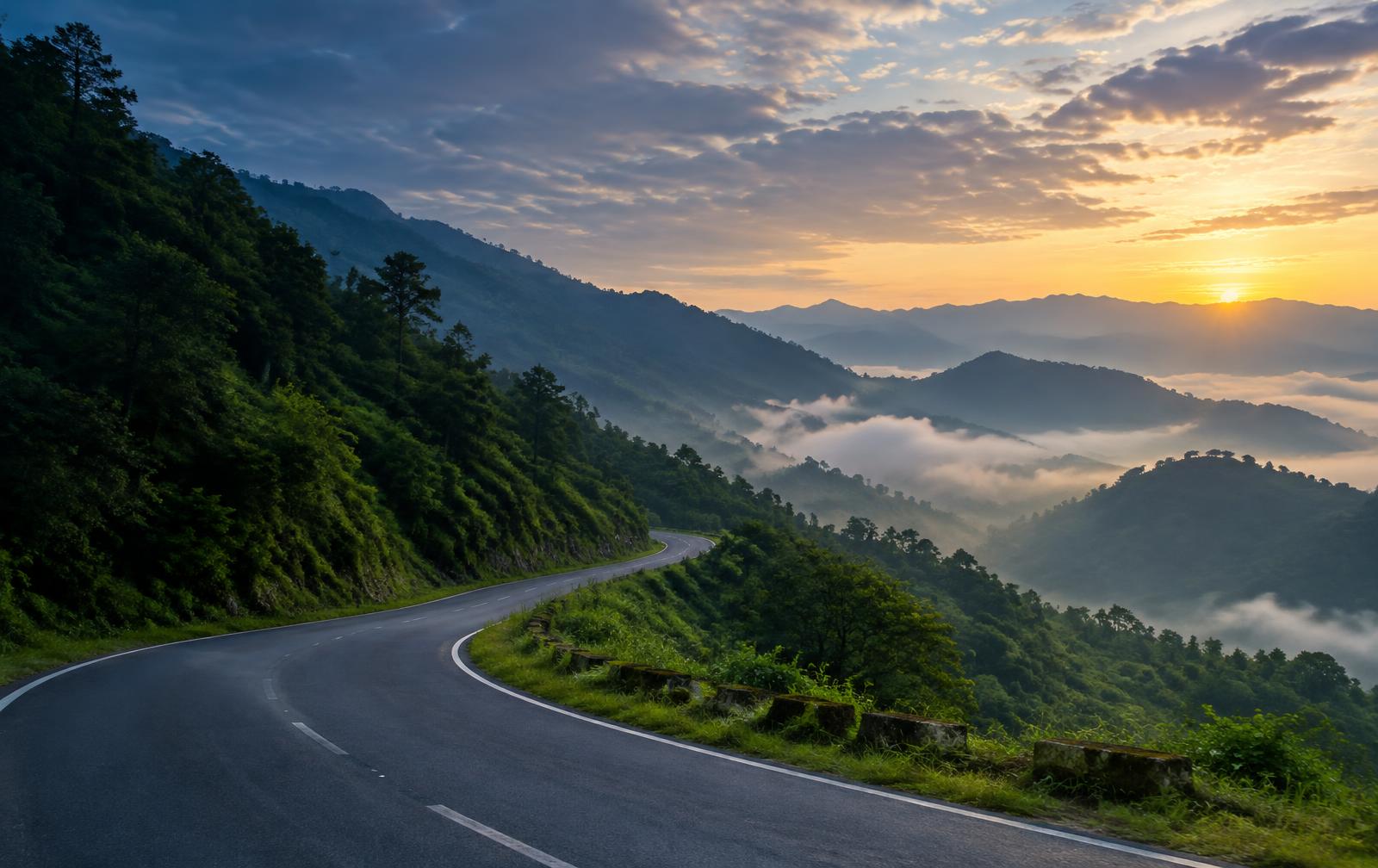 Misty Himalayan mountain road winding through the Uttarakhand foothills